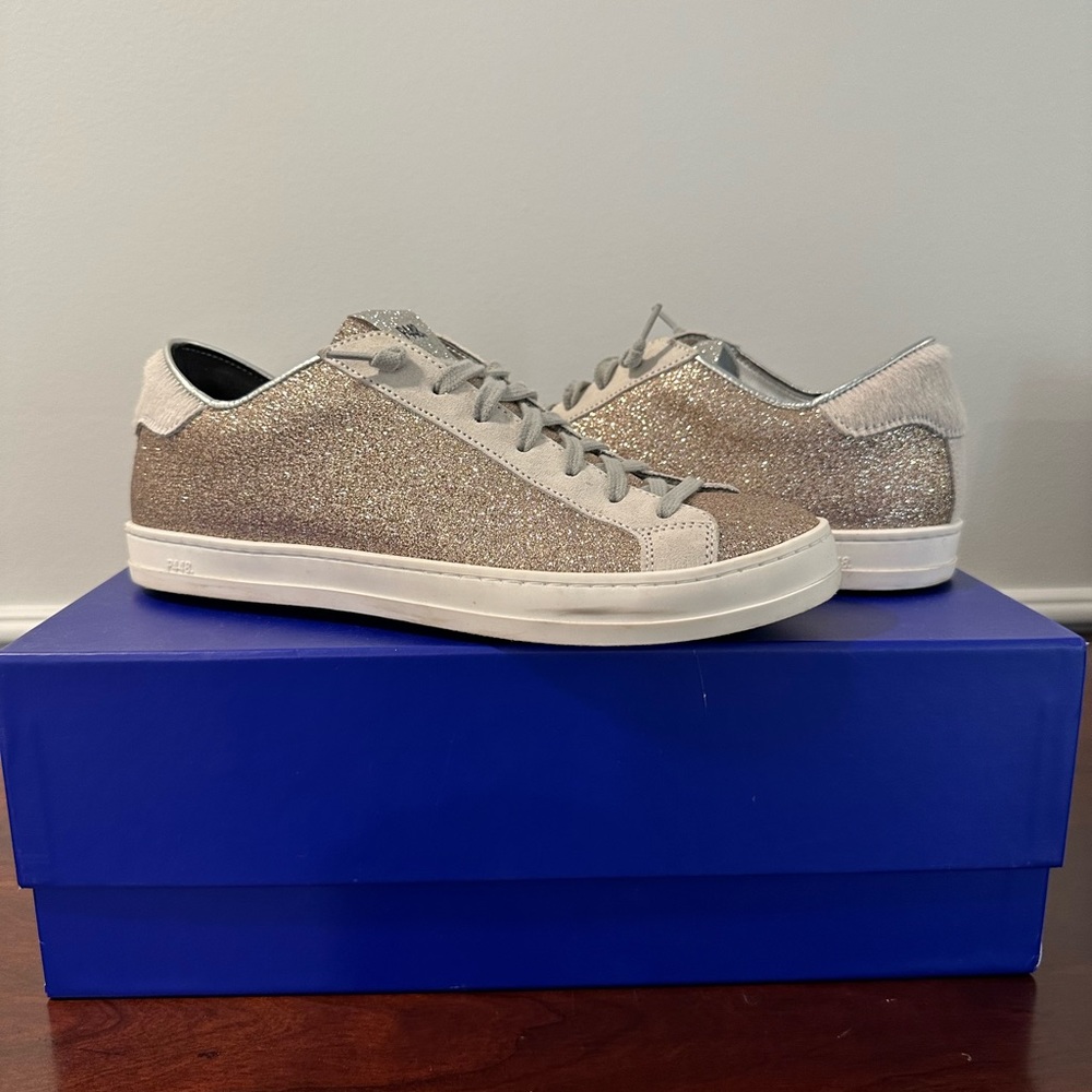 P448 glitter sneaker with fur heel.